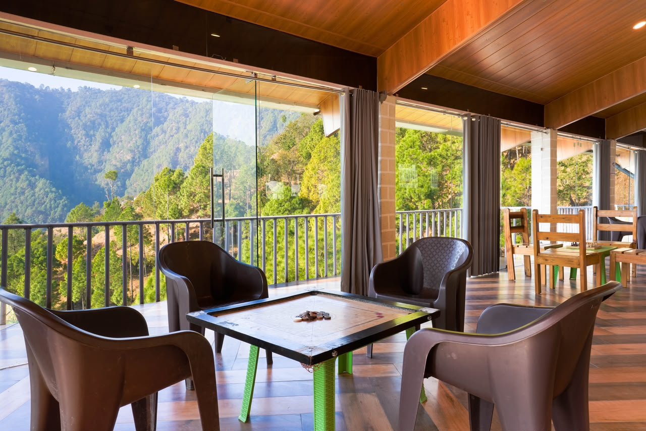 Games lounge with carrom and valley view - Hamilton Palace Lansdowne